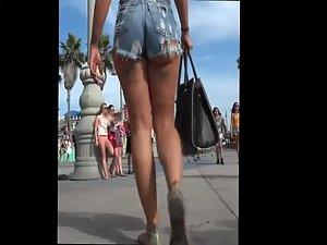 Tattooed girl in torn jeans shorts Picture 5