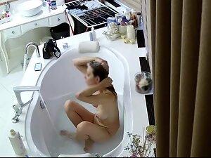 Spying on busty wife taking a bath Picture 4