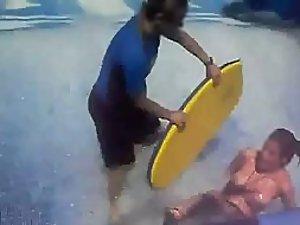 Her tits fall out on the water slide