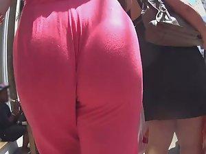 Fancy woman got a wedgie in pink jumpsuit Picture 1