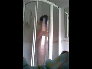 Naked babe spied while under a shower Picture 3