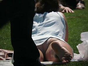 Wet stain on panties of a girl in the park Picture 4