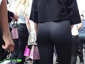Voyeur focuses on hot ass in black leggings Picture 3