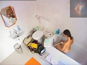 Sweet girl pissing and showering off Picture 2