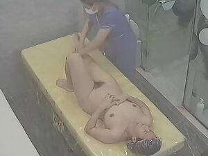 Hidden cam caught naked milf getting a massage