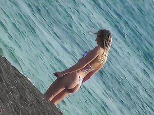 Hottie in thong bikini can't decide if she should swim Picture 2