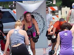 Happy busty girl during group cycling workout Picture 2