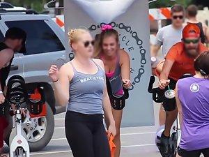 Happy busty girl during group cycling workout Picture 5