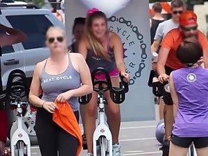 Happy busty girl during group cycling workout Picture 6