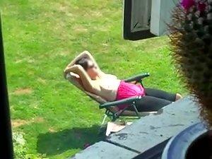 Neighbor spied while tanning her boobs Picture 2