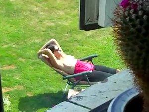 Neighbor spied while tanning her boobs Picture 3