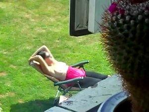 Neighbor spied while tanning her boobs Picture 5