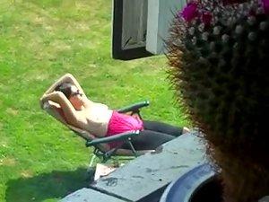 Neighbor spied while tanning her boobs Picture 7