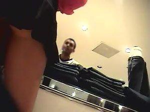 Upskirt of a girl in a black mini skirt Picture 6