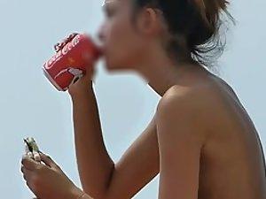 Young topless girl eating and drinking