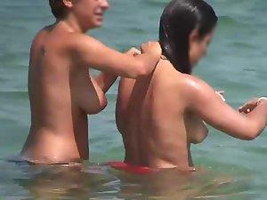 Two topless girls grabbing each other Picture 4