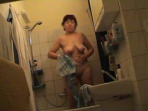 Older woman dries herself off Picture 2