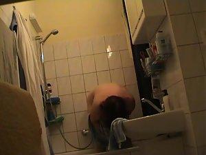 Older woman dries herself off Picture 5