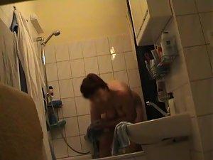 Older woman dries herself off Picture 7