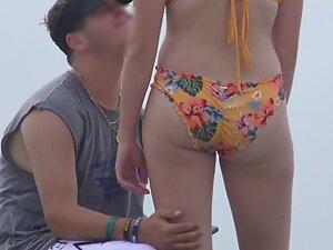 Zooming in on nice ass in very colorful bikini Picture 5