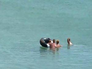 Three horny nudists spied having sex Picture 4