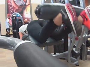 Sexy girl does leg curls in gym Picture 4