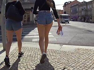 Incredibly sexy girl passing flyers on the street