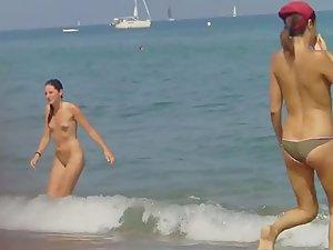 Checking out nudist woman's tattoo Picture 1