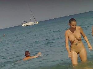 Checking out nudist woman's tattoo Picture 6