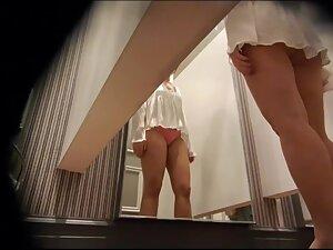 Peep on her big tits while she tries out a new white shirt Picture 1