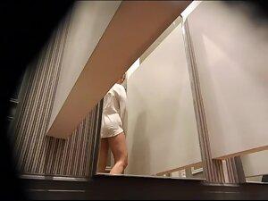 Peep on her big tits while she tries out a new white shirt Picture 6