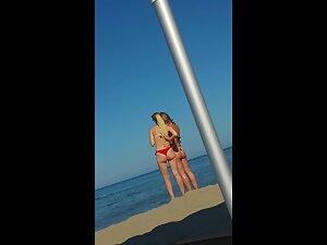 Hot milf and younger blonde together at beach Picture 4