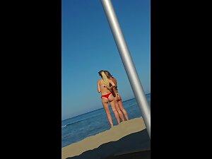 Hot milf and younger blonde together at beach Picture 5
