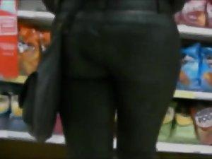 She picks up snacks from the shelf Picture 6
