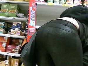 She picks up snacks from the shelf Picture 8