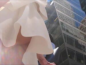 Upskirt of sexy rich girl on the street Picture 3