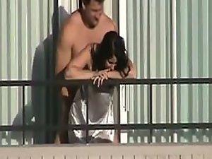Girl fucked from behind on the balcony