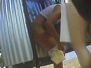 Teenage girl puts a skirt on