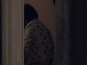 Peeping on a girl preparing for bed