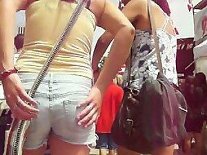 Following a girl in short jeans pants Picture 1