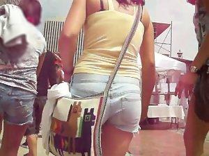 Following a girl in short jeans pants Picture 2