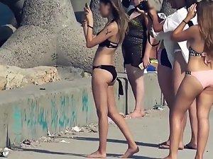 Cameltoe shows teen pussy in beige bikini Picture 2