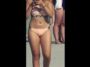 Cameltoe shows teen pussy in beige bikini Picture 5