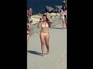 Cameltoe shows teen pussy in beige bikini Picture 6