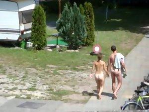 Nudist couple going to their camp Picture 5