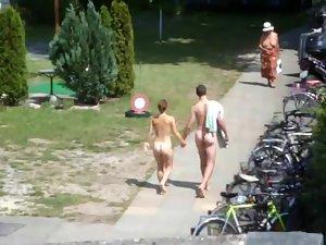 Nudist couple going to their camp Picture 6