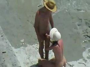 Couple with hats enjoy sex on a beach Picture 7