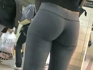 Voyeur is charmed by an ass at a subway