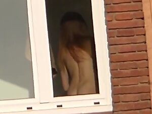 Glimpses of hot naked neighbor in window