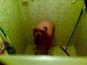 Sexy woman spied naked under a shower Picture 3